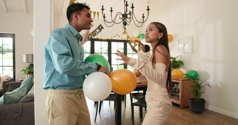 Friends Decorating Living Room for Birthday Celebration