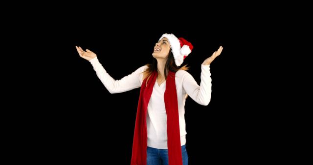 Joyful Woman Wearing Santa Hat Celebrating Christmas - Download Free Stock Images Pikwizard.com