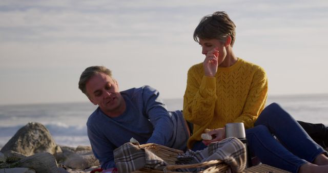 Couple Enjoying Relaxing Picnic by the Sea - Download Free Stock Images Pikwizard.com
