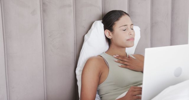 Woman in Bed Feeling Stress While Working on Laptop - Download Free Stock Images Pikwizard.com