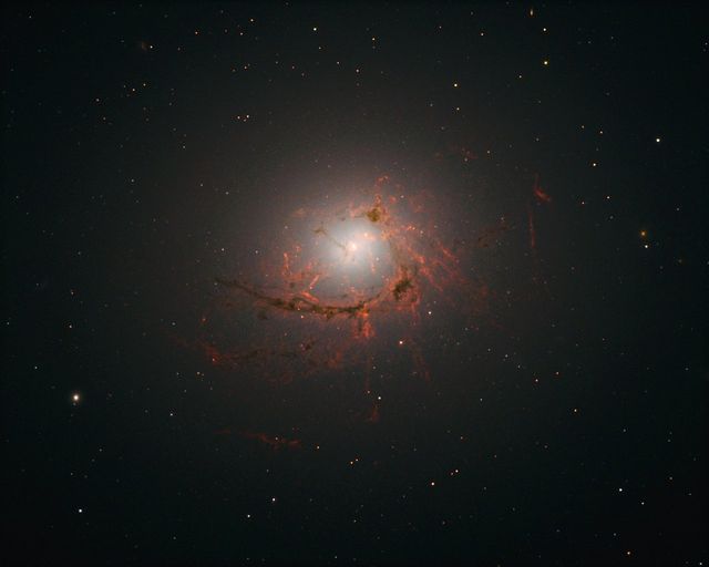 New observations from the NASA/ESA Hubble Space Telescope have revealed the intricate structure of the galaxy NGC 4696 in greater detail than ever before. The elliptical galaxy is a beautiful cosmic oddity with a bright core wrapped in system of dark, swirling, thread-like filaments.  Read more: <a href="http://bit.ly/2gLGojx" rel="nofollow">bit.ly/2gLGojx</a>  <b><a href="http://www.nasa.gov/audience/formedia/features/MP_Photo_Guidelines.html" rel="nofollow">NASA image use policy.</a></b>  <b><a href="http://www.nasa.gov/centers/goddard/home/index.html" rel="nofollow">NASA Goddard Space Flight Center</a></b> enables NASA’s mission through four scientific endeavors: Earth Science, Heliophysics, Solar System Exploration, and Astrophysics. Goddard plays a leading role in NASA’s accomplishments by contributing compelling scientific knowledge to advance the Agency’s mission.  <b>Follow us on <a href="http://twitter.com/NASAGoddardPix" rel="nofollow">Twitter</a></b>  <b>Like us on <a href="http://www.facebook.com/pages/Greenbelt-MD/NASA-Goddard/395013845897?ref=tsd" rel="nofollow">Facebook</a></b>  <b>Find us on <a href="http://instagrid.me/nasagoddard/?vm=grid" rel="nofollow">Instagram</a></b>    