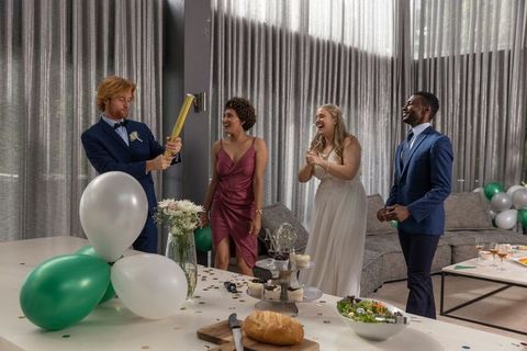 Joyous wedding celebration with stylish friends and gold confetti