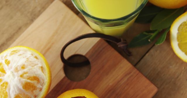 Freshly Squeezed Orange Juice on Wooden Cutting Board - Download Free Stock Images Pikwizard.com