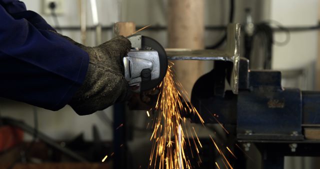 Worker Grinding Metal with Sparks in Industrial Workshop - Download Free Stock Images Pikwizard.com