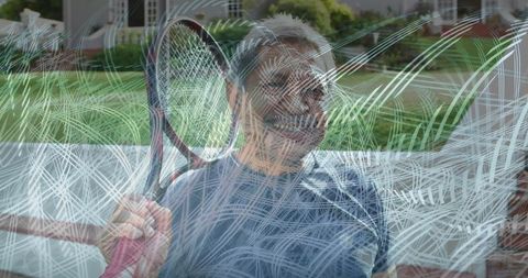 Senior Man Relaxing at Outdoor Tennis Court Holding Racquet