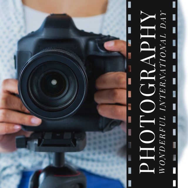 Perfect for celebrating International Photography Day, this image features a close-up of a professional photographer holding a digital camera on a tripod. Ideal for use in photography blogs, promotional materials for photography courses, advertisements for camera equipment, and social media posts highlighting photography events and tips.