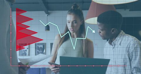 Diverse Team Analyzing Financial Data with Graph Overlay in Modern Office