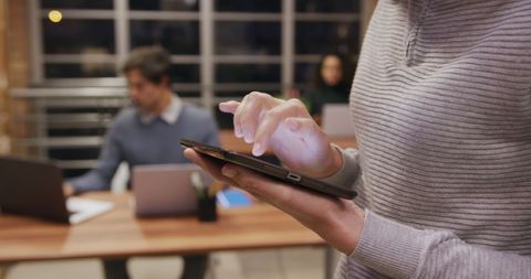 Professional Businesswoman Using Tablet in Modern Office Environment - Download Free Stock Images Pikwizard.com