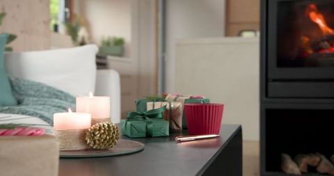 Contemporary Living Room with Lit Candles and Festive Decor