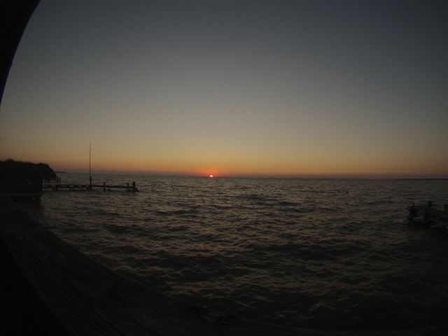 Serene Sunset Over Calm Lake with Pier Silhouettes - Download Free Stock Images Pikwizard.com