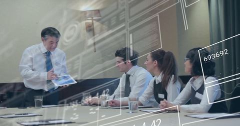 Business Professional Shares Digital Financial Data in Meeting