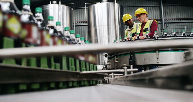 Engineers Inspecting Bottling Line at Beverage Manufacturing Plant - Download Free Stock Images Pikwizard.com