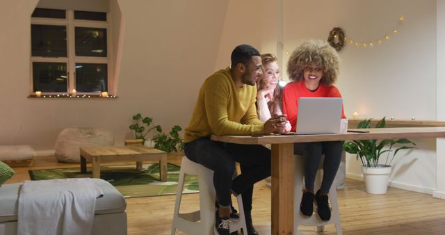 Group of Young Adults Working Together on Laptop in Cozy Living Room - Download Free Stock Images Pikwizard.com