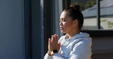 Woman Practicing Mindfulness Outdoors in Casual Attire