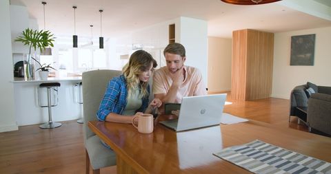 Couple Planning Next Steps at Home Using Laptop Over Coffee - Download Free Stock Images Pikwizard.com