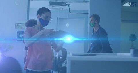 Diverse Team Working Together in Modern Office With Digital Overlay