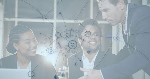 Business Team Analyzing Digital Network with Enthusiasm