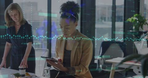 Financial Analysis with Digital Tablet in Modern Office