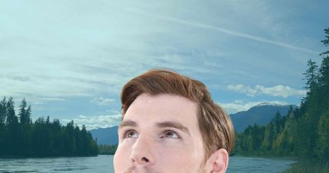 Pensive Young Man Amidst Serene Mountain Landscape