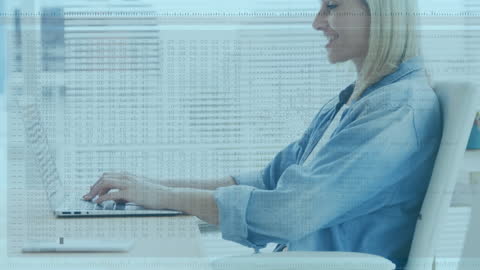 Businesswoman Using Laptop with Data Overlay in Modern Office
