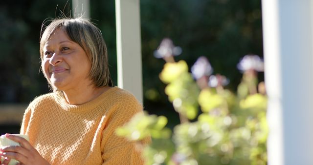 Smiling Senior Woman Relaxing Outdoors with Cup of Tea - Download Free Stock Images Pikwizard.com