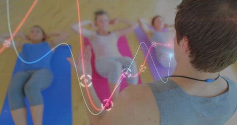 Fitness instructor conducting mat workout with data overlay