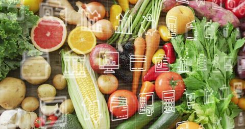 Displaying fresh market produce flat-lay with digital data icons for grocery analytics