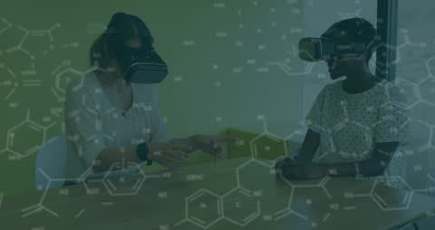Women Engaging in Virtual Reality Experience with Chemical Formulas