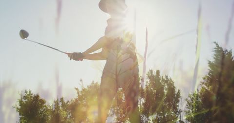 Senior Woman Playing Golf in Sunny Landscape - Download Free Stock Images Pikwizard.com