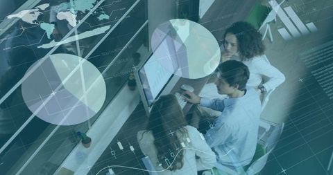 Finance Team Analyzing Global Market Data on Computers in Modern Office