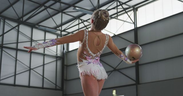 Female Rhythmic Gymnast Performing with Ball in Sports Hall - Download Free Stock Images Pikwizard.com