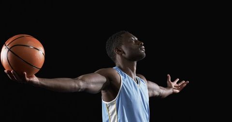 Athlete Holding Basketball with Outstretched Arms on Court - Download Free Stock Images Pikwizard.com