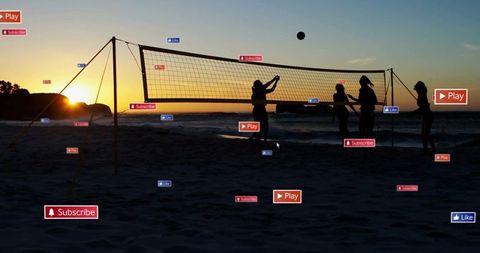 Silhouetted Women Playing Beach Volleyball at Sunset