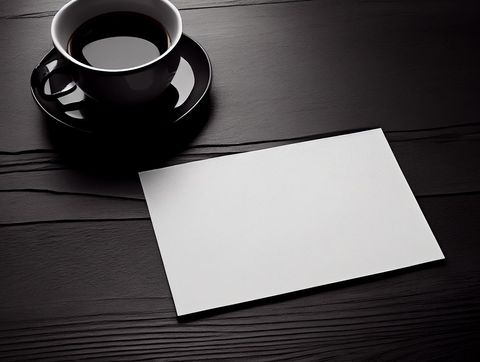 Blank letterhead next to coffee on wooden surface design