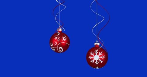 Festive Red Christmas Ornaments on Blue Background