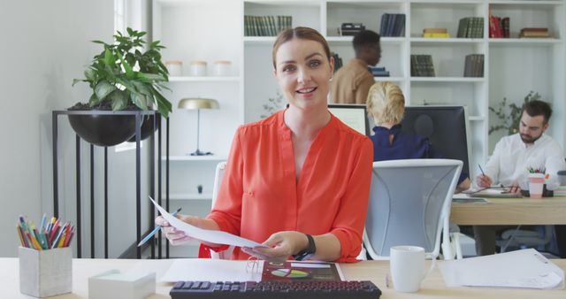 Female Professional Smiling and Working in Modern Office - Download Free Stock Images Pikwizard.com