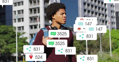 Young man interacting with social media analytics icons in urban setting