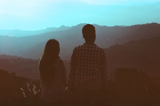 Couple in Silhouette Admiring Serene Mountain View at Sunset - Download Free Stock Photos Pikwizard.com