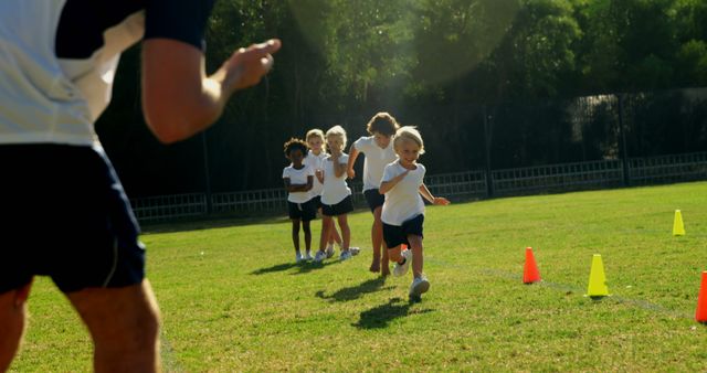 Children Engaging in Outdoor Fitness Game with Coach Persently Guide - Download Free Stock Images Pikwizard.com