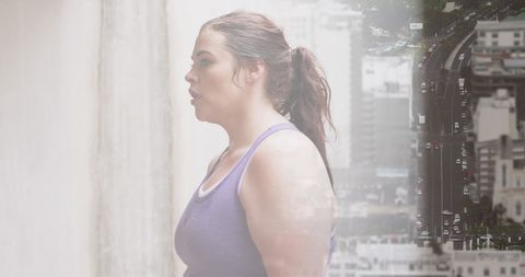 Plus Size Woman Exercising in Urban City Environment