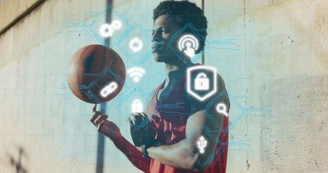 Young man balancing basketball with futuristic interface overlay