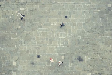 Aerial View of Cobblestone Plaza with Figures Strolling