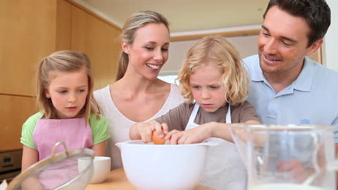 Family Enjoying Baking Time Together in Kitchen