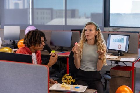 Diverse Coworkers Enjoying Birthday Celebration in Modern Office