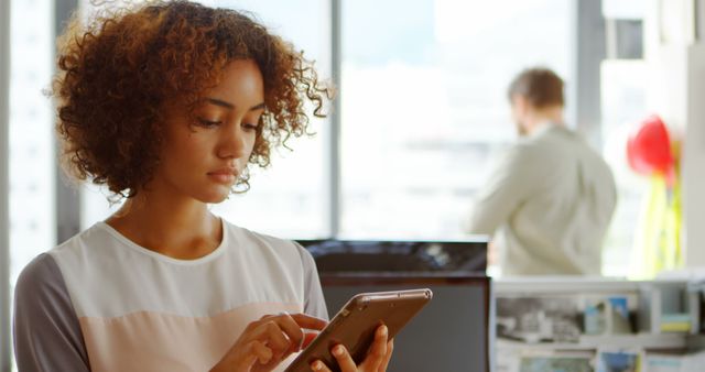 Professional Woman Using Tablet in Office Environment - Download Free Stock Images Pikwizard.com