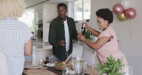Happy Family Decorating Dining Area for Celebration at Home