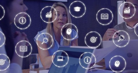 Business team collaborating in boardroom with digital analytics icons overlay and data visualization