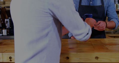 Busy Cafe Barista Serving Coffee with Modern Urban Touch