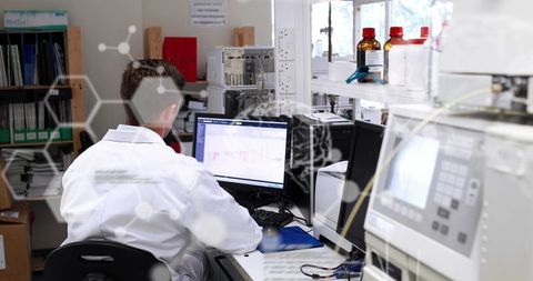 Male Scientist Analyzing Data at Laboratory Desk - Download Free Stock Images Pikwizard.com