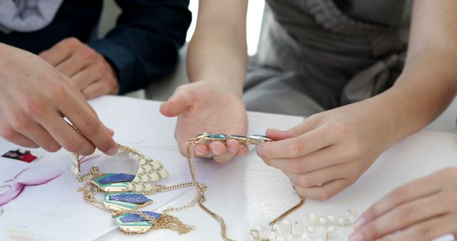 Design team looking at costume jewelry in their studio